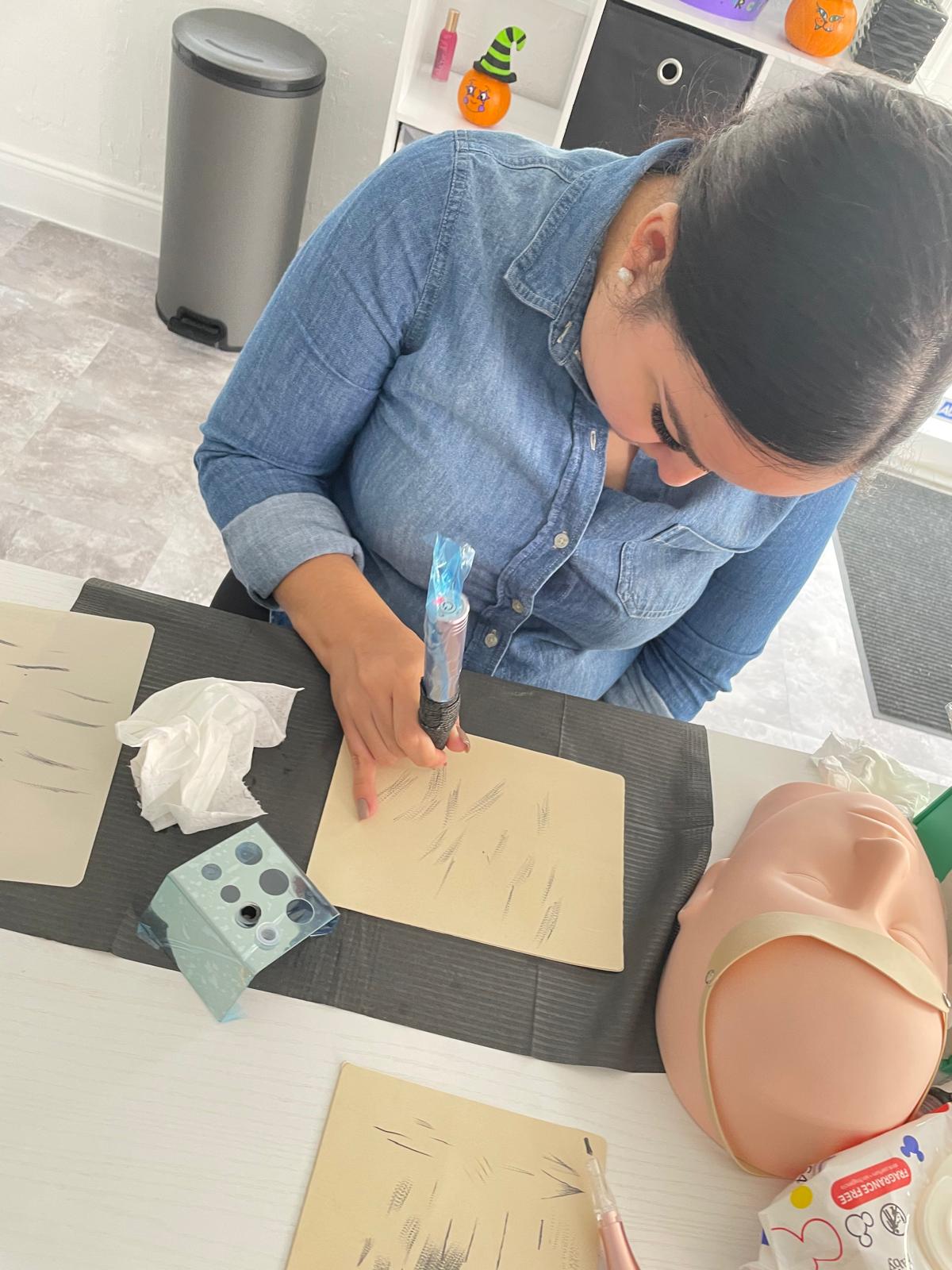 Trainee practicing brow strokes