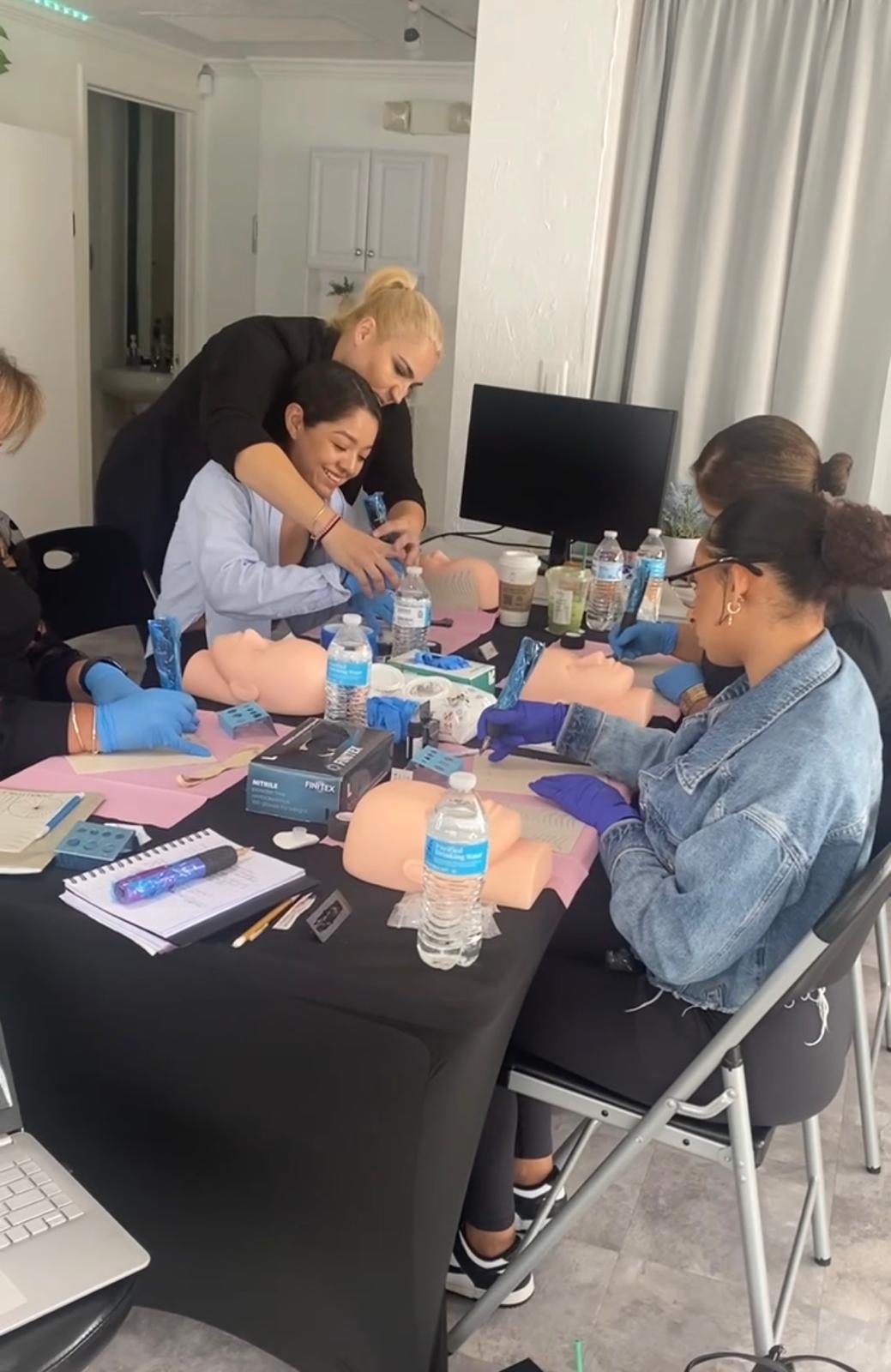 Linda mentoring students at the training table